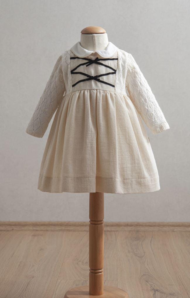 Girl Baby Off-White Dress with Black Ribbon Detail, Peter Pan Collar, and Lace Sleeves (6-36 Months)