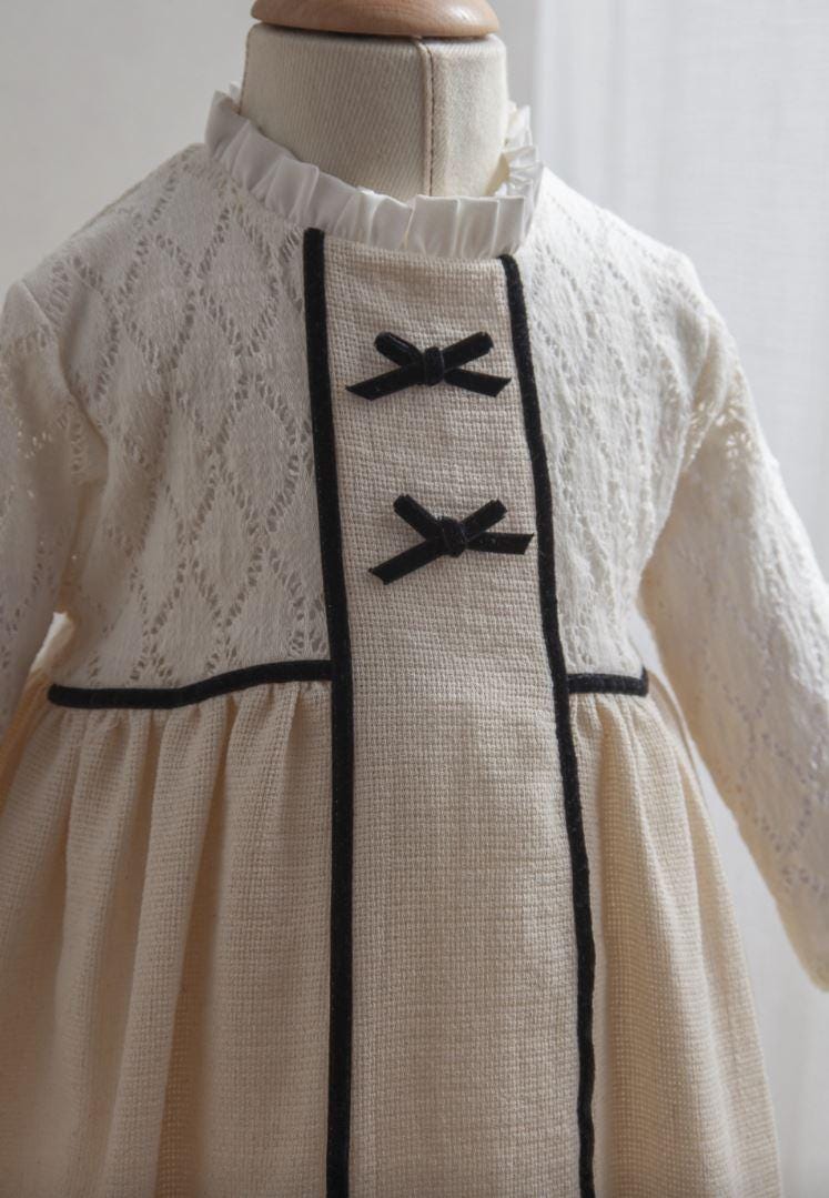 Girl Baby Off-White Dress with Black Ribbon Detail, Peter Pan Collar, and Lace Sleeves (6-36 Months)