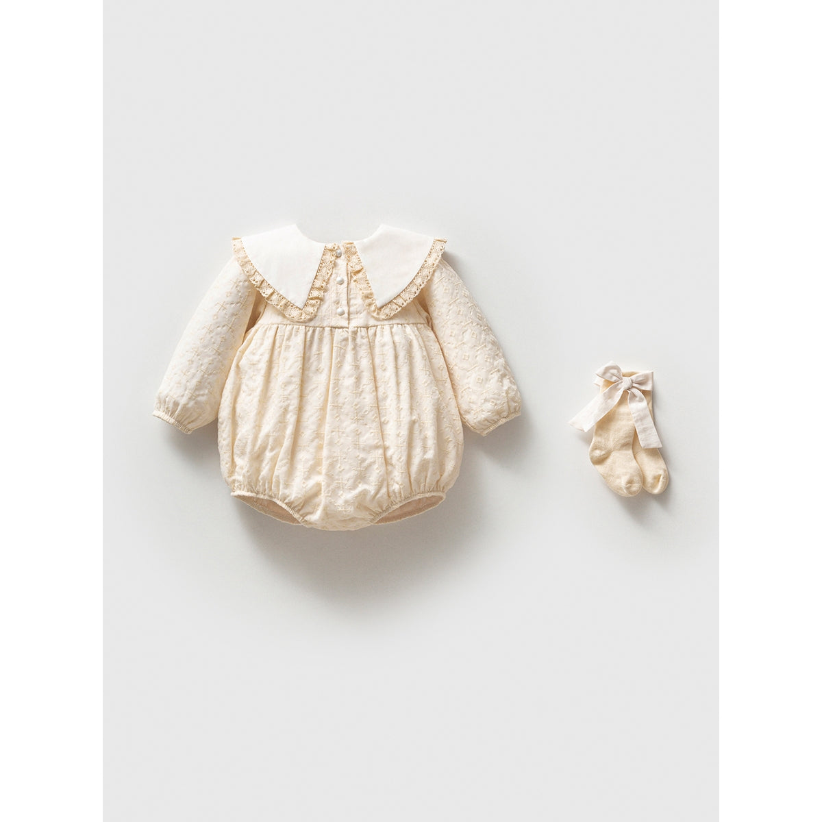 Elegant baby romper with lace collar and matching socks