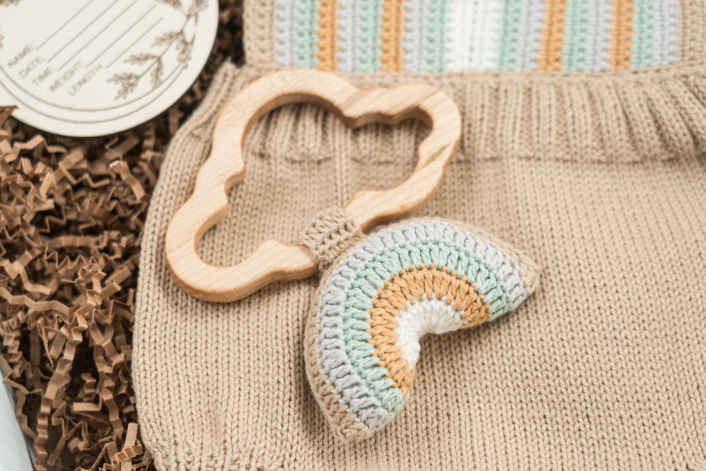 Crochet Baby Romper with Rainbow Rattle: Boho Knit Outfit