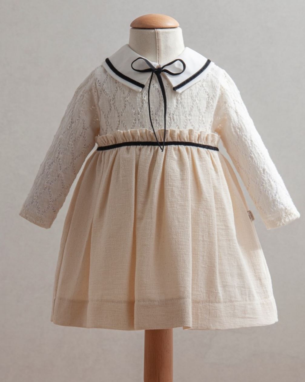 Girl Baby Off-White Dress with Black Ribbon Detail, Peter Pan Collar, and Lace Sleeves (6-36 Months)
